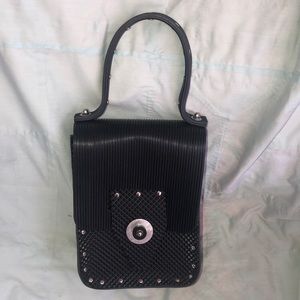 Metal and vinyl hand bag